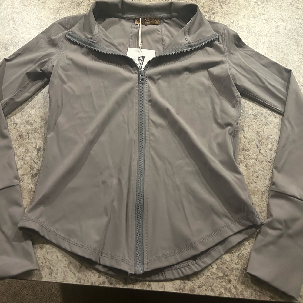 Athleisure jacket. Has thumb holes. Size small